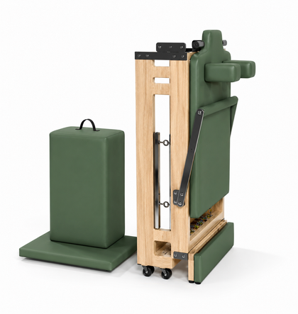 REFORMIA Wooden Foldable Pilates Reformer with Sage Green upholstery and premium oak wood frame, three-quarter studio view